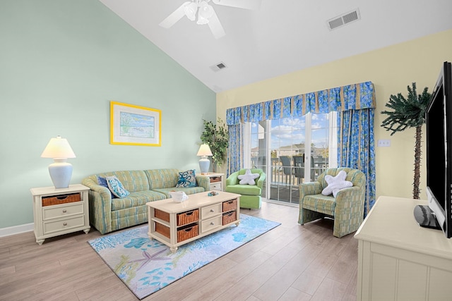 living room with high vaulted ceiling, ceiling fan, and light hardwood / wood-style floors