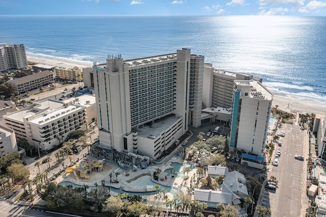 bird's eye view featuring a view of the beach and a water view