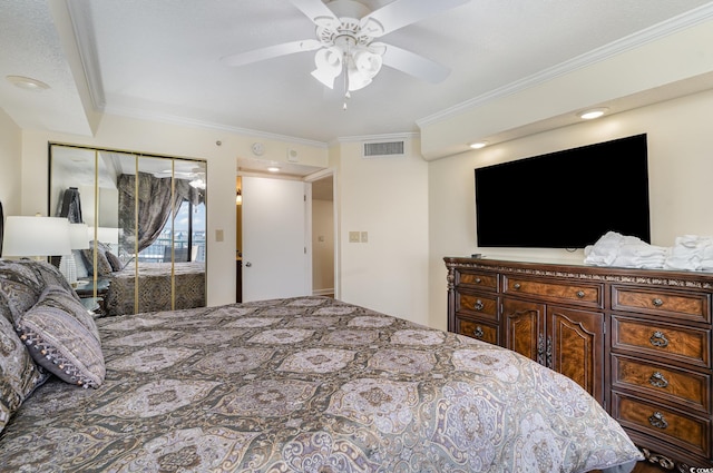 bedroom with ornamental molding, a closet, and ceiling fan