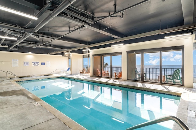 view of pool with a jacuzzi