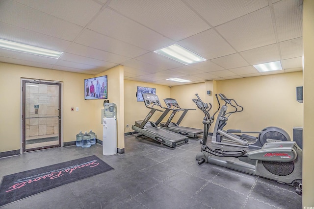 exercise room featuring a paneled ceiling