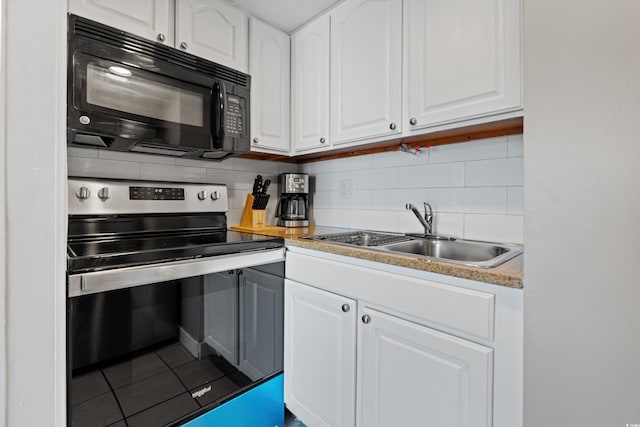 kitchen with white cabinets, stainless steel electric range oven, backsplash, and sink