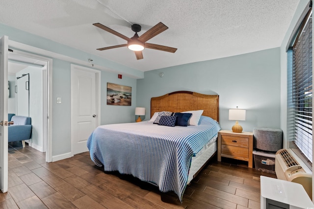 bedroom featuring ceiling fan, dark hardwood / wood-style flooring, and a textured ceiling