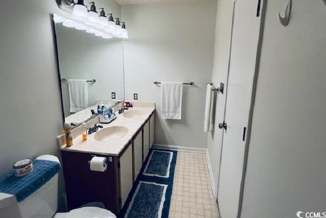 bathroom with vanity and toilet