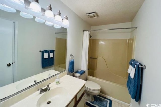 full bathroom with vanity, shower / tub combo, a textured ceiling, and toilet