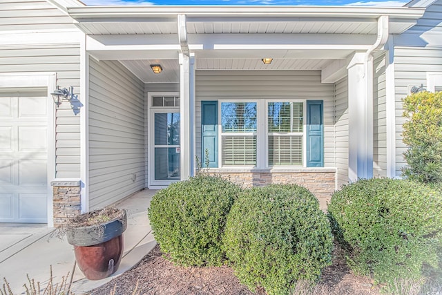 property entrance with a garage