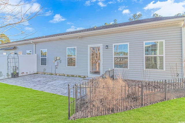 view of front facade with a patio area and a front lawn