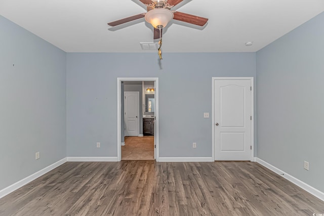 unfurnished bedroom featuring hardwood / wood-style flooring and ceiling fan