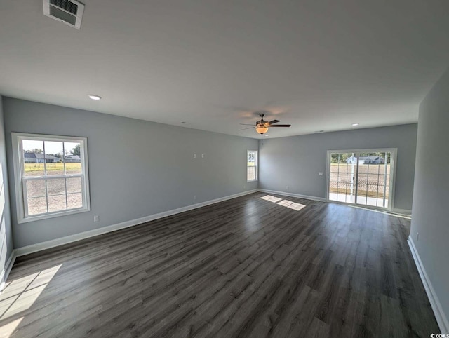 spare room featuring visible vents, baseboards, ceiling fan, dark wood finished floors, and recessed lighting