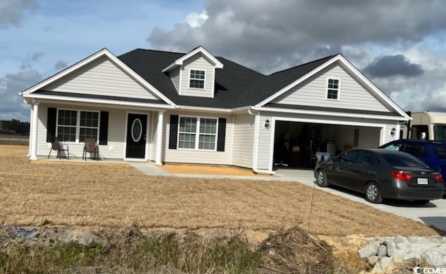 view of front facade featuring covered porch and a garage