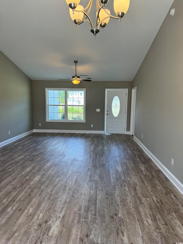 entryway featuring ceiling fan with notable chandelier and dark hardwood / wood-style flooring