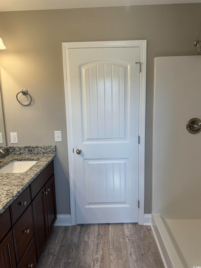 bathroom featuring vanity and hardwood / wood-style floors