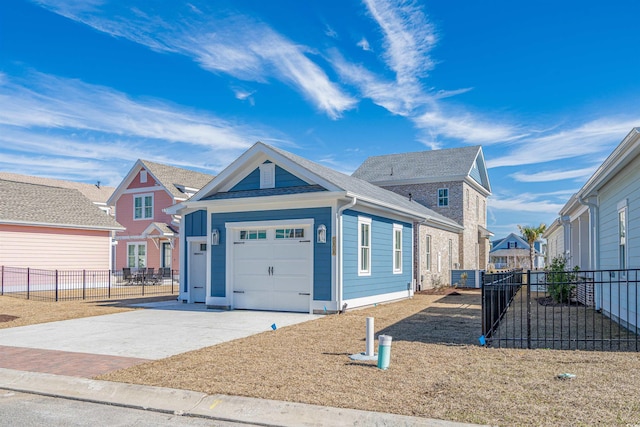 view of front facade with a residential view, concrete driveway, fence, and an attached garage