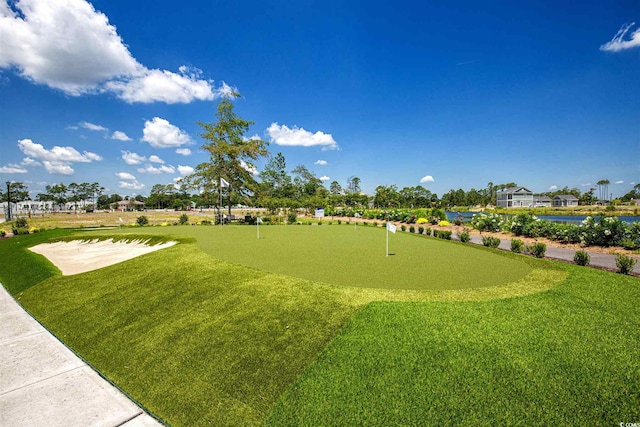 view of property's community with a lawn