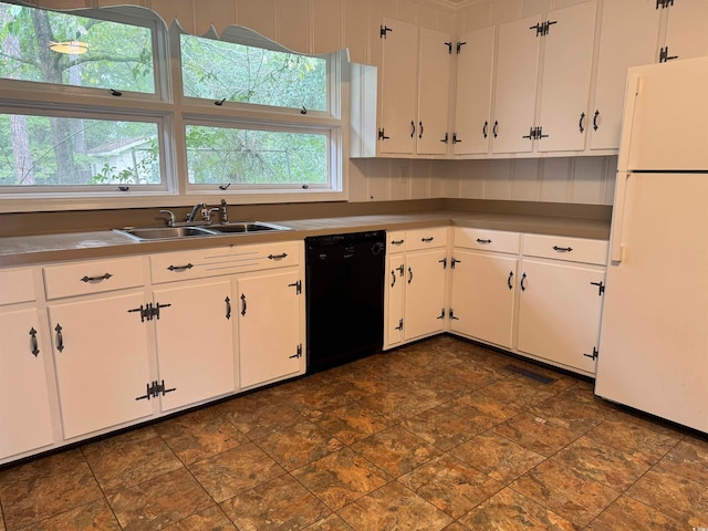 kitchen with white cabinets, black dishwasher, sink, and white fridge