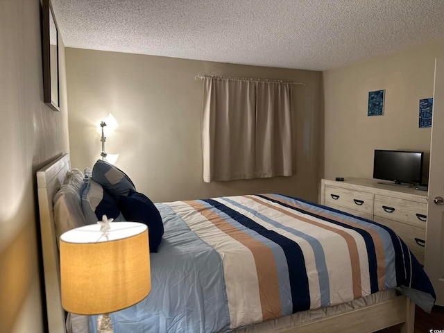 bedroom featuring a textured ceiling