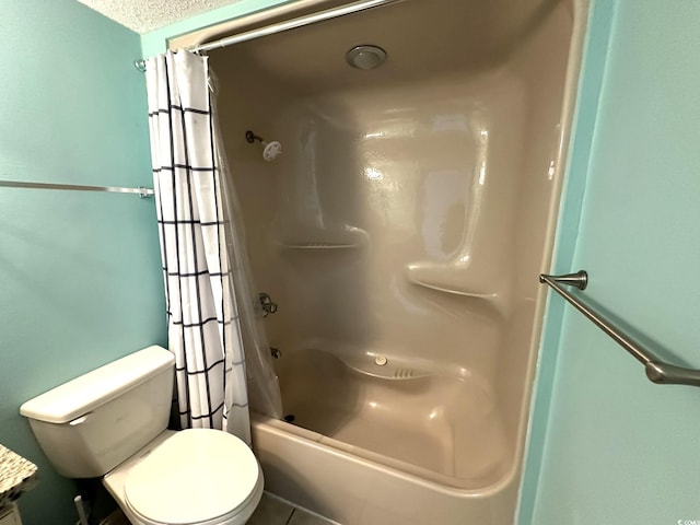 bathroom with shower / bath combination with curtain, toilet, and a textured ceiling