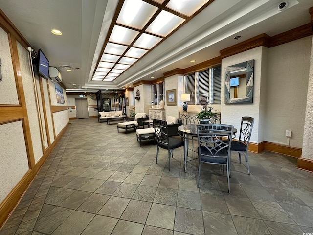 interior space featuring tile flooring and a raised ceiling