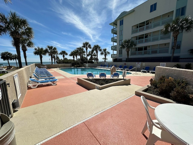 view of pool featuring a patio