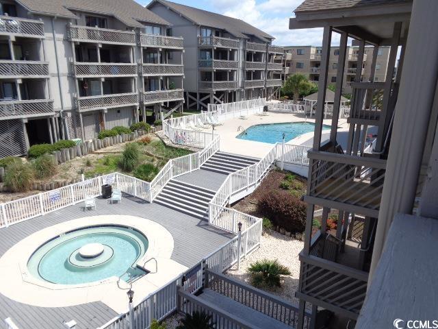 view of pool with a community hot tub