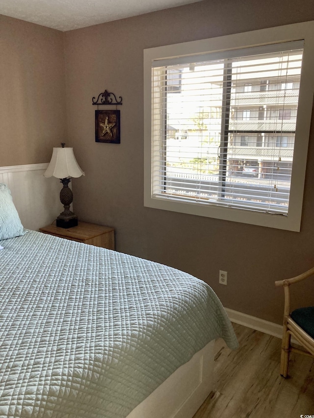 bedroom featuring wood-type flooring