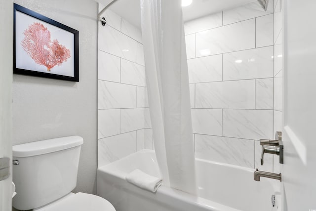 bathroom featuring toilet and shower / bath combination with curtain