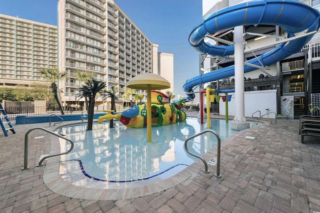 view of pool featuring a water slide