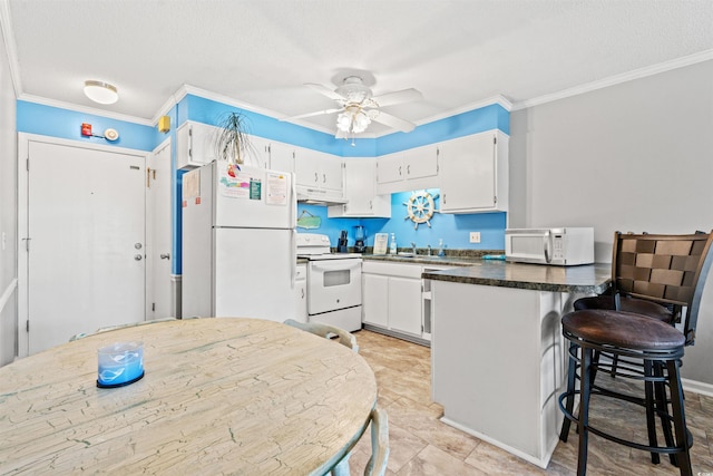 kitchen with crown molding, white cabinets, a textured ceiling, white appliances, and ceiling fan