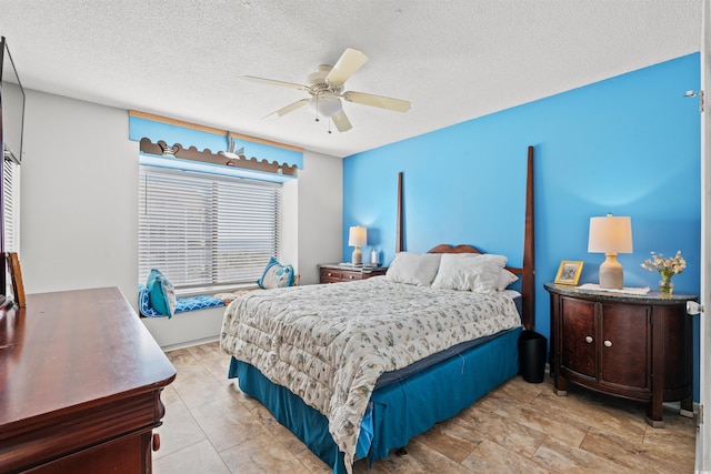 bedroom featuring a textured ceiling and ceiling fan