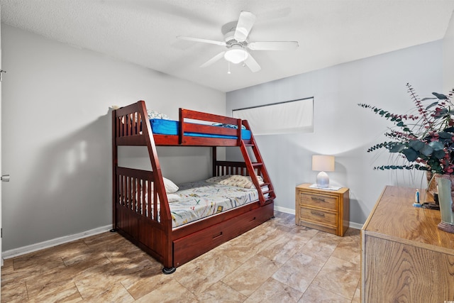 bedroom featuring a textured ceiling and ceiling fan