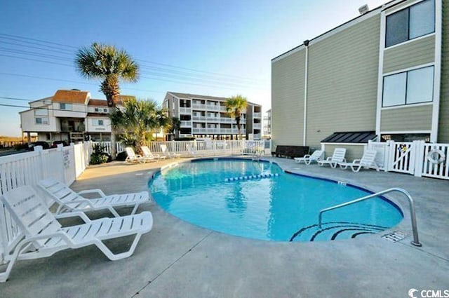 view of pool featuring a patio area