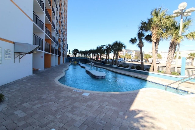 view of pool featuring a patio