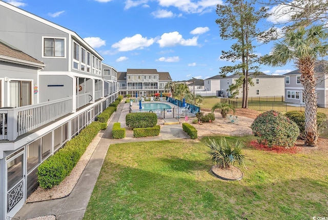 view of yard with a fenced in pool