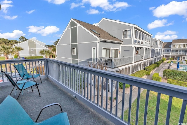 balcony featuring a swimming pool