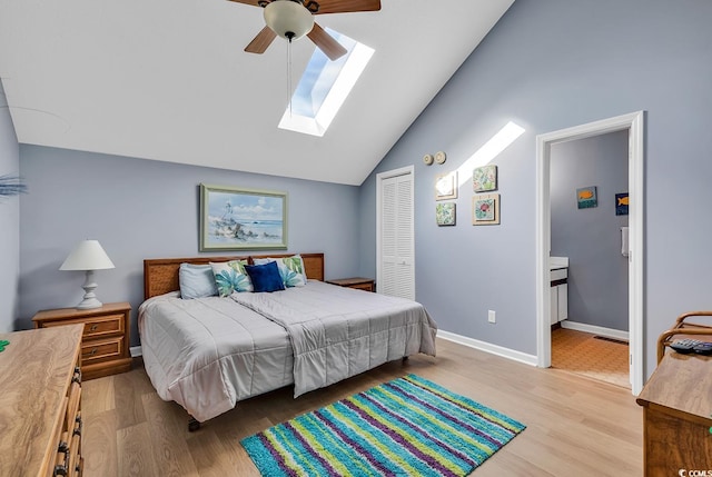 bedroom with light hardwood / wood-style floors, ceiling fan, a closet, and ensuite bathroom