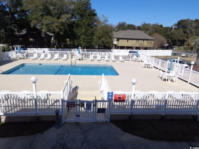 view of swimming pool featuring a patio