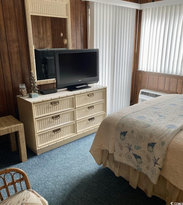 carpeted bedroom with wooden walls