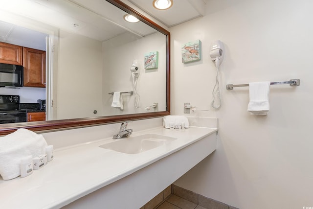 bathroom featuring tile floors and large vanity