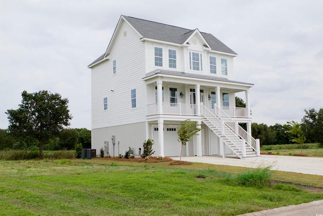 view of front facade with central AC, a front lawn, and a garage