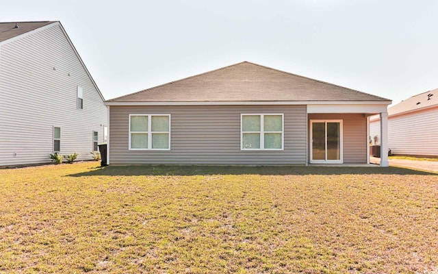 back of house with a yard