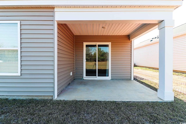 doorway to property featuring a patio area