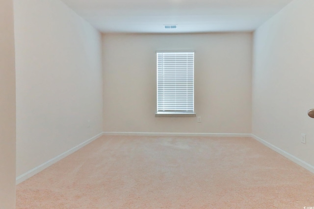 empty room with light colored carpet