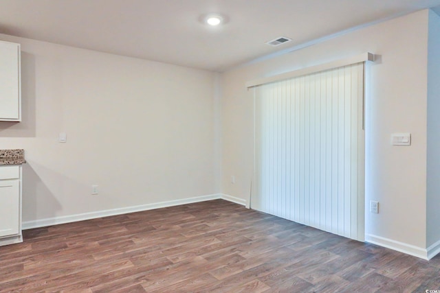 interior space with dark hardwood / wood-style flooring