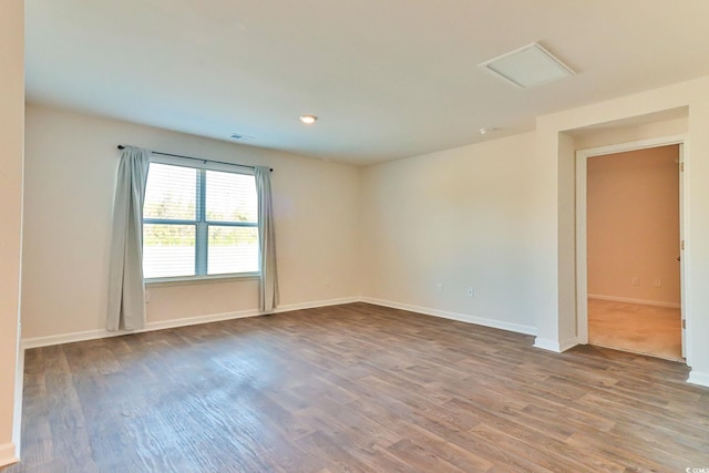 empty room featuring hardwood / wood-style floors