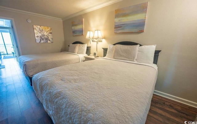 bedroom featuring ornamental molding and dark hardwood / wood-style floors