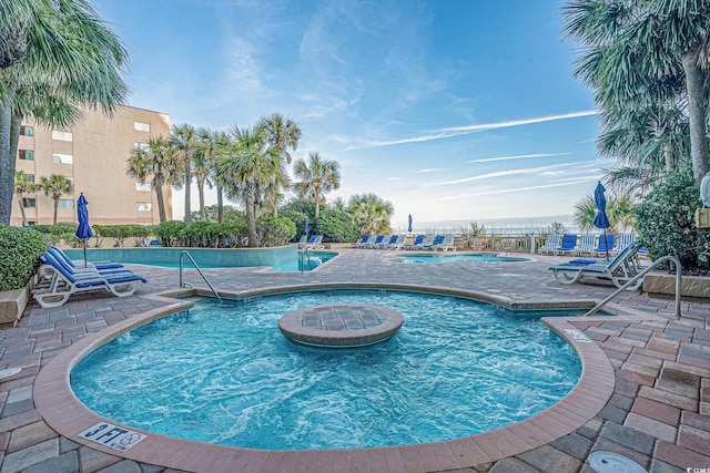 view of swimming pool featuring a patio area