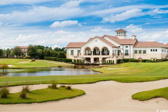 surrounding community featuring a yard and a water view