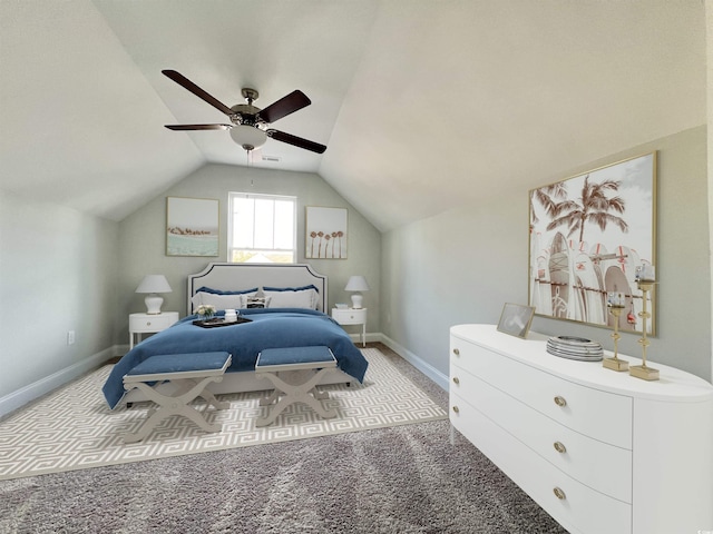 bedroom featuring ceiling fan, vaulted ceiling, and light colored carpet