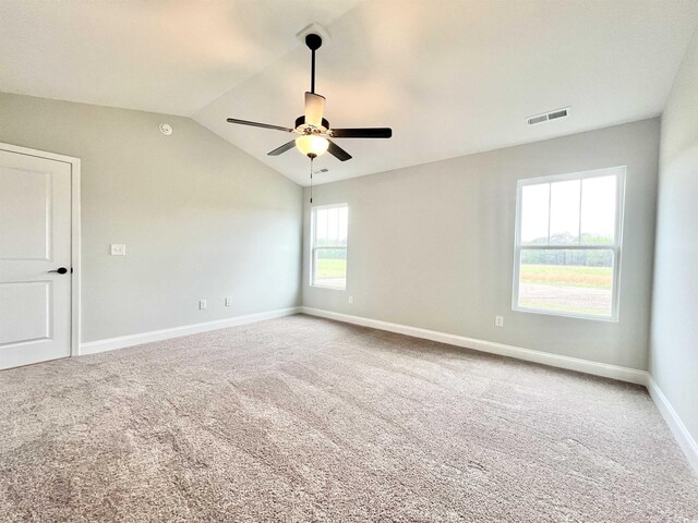 1424 Nathan Dr, Loris, SC 29569 - carpeted spare room featuring visible vents, a ceiling fan, baseboards, and vaulted ceiling