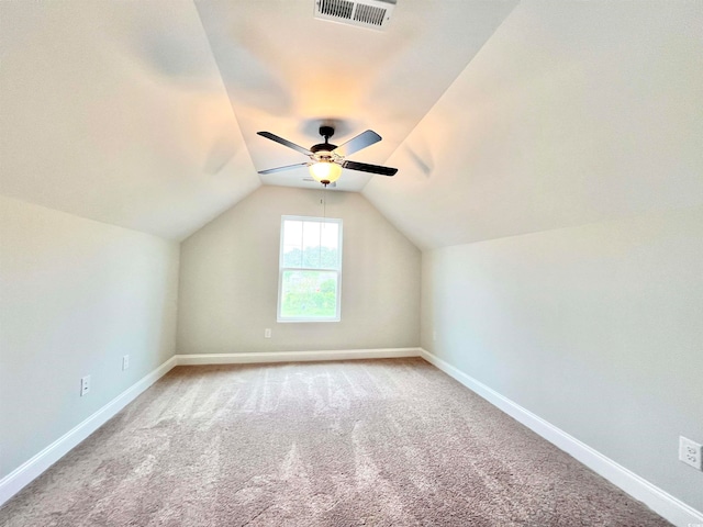 bonus room featuring lofted ceiling, carpet, and ceiling fan